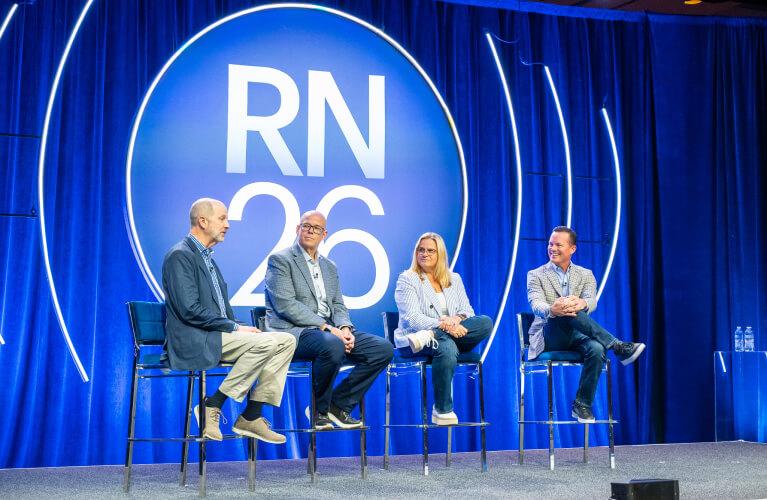Four panelists speak during a session at RightNOW26.