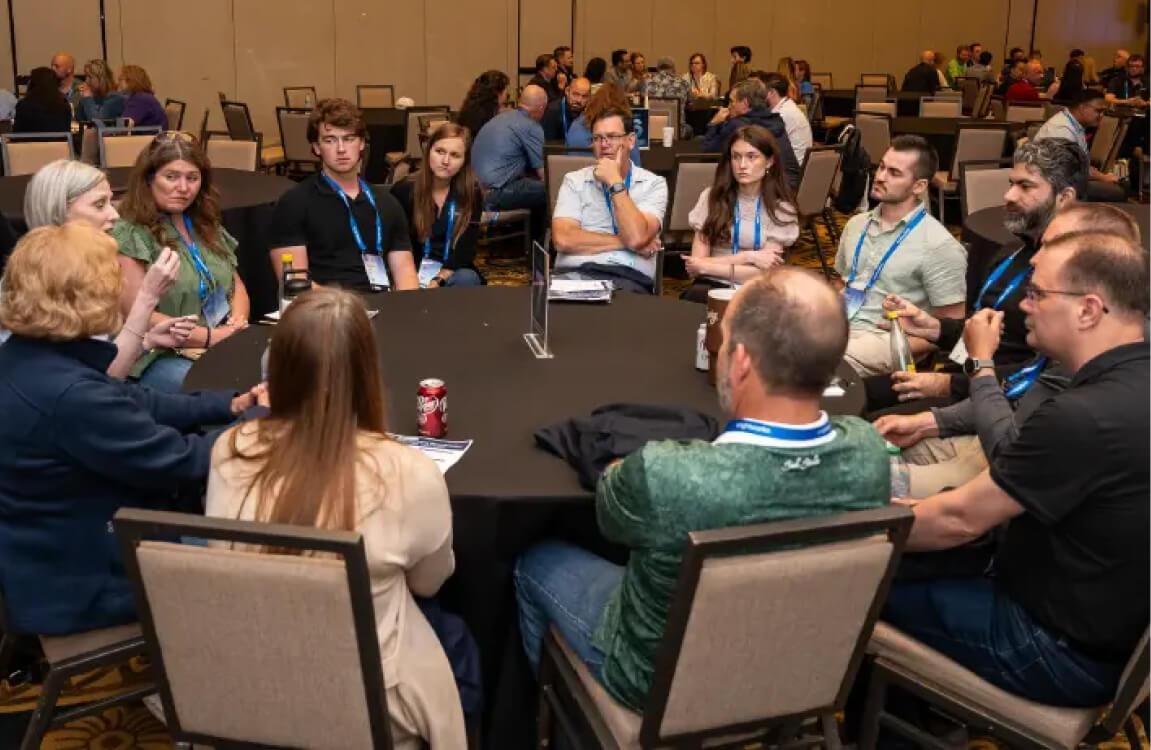 Attendees at a roundtable discussion